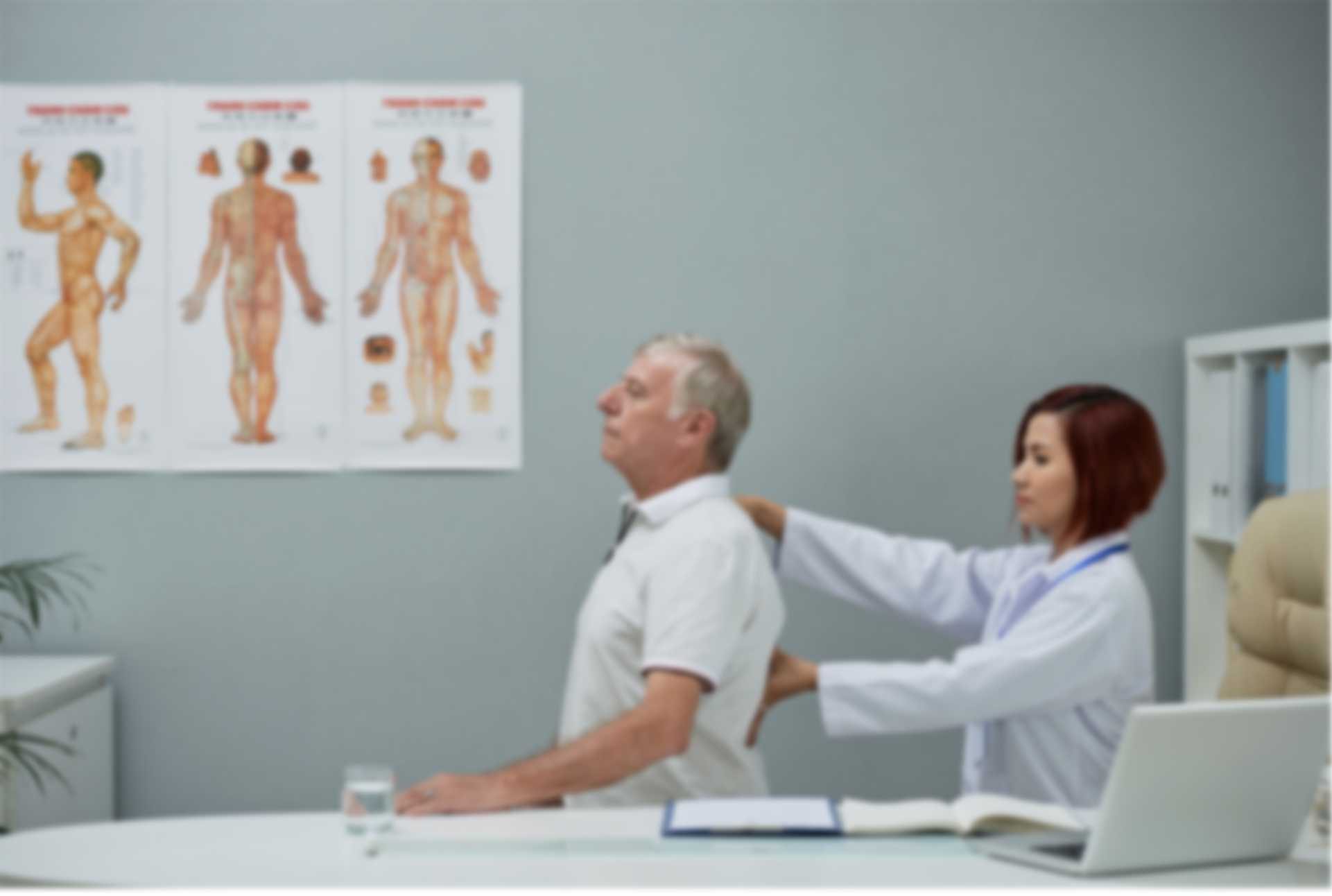 Doctor examining elderly patient
