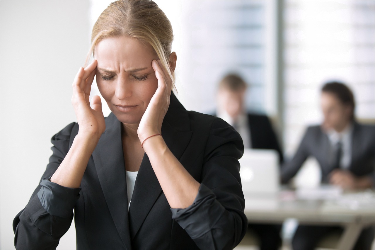 Stressed woman in office setting